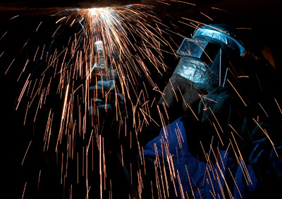 welder welding with fire sparks